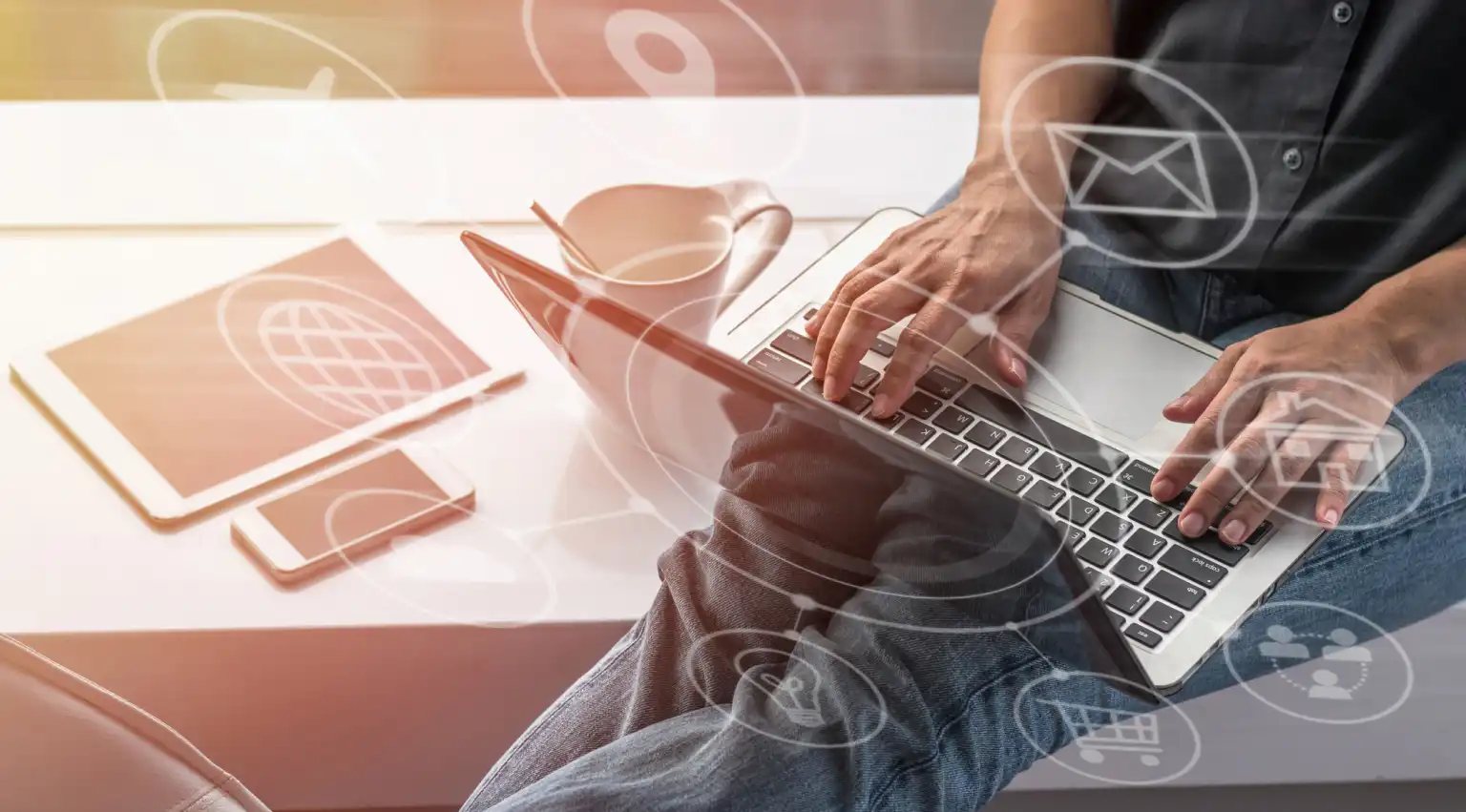 Person sitting, hands typing on Macbook